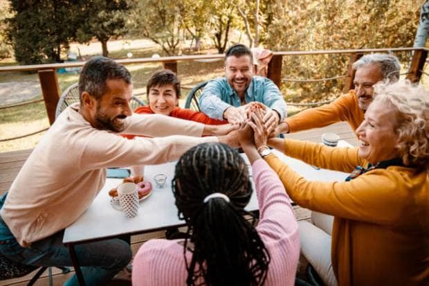 Stay connected: Keep in contact with family, friends, or join a support group to reduce the feelings of isolation. (Photo source: Canva)