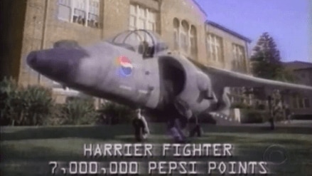 In the ad, a teenager lands a Harrier fighter jet outside his school with onscreen text stating the aircraft could be redeemed for 7 million Pepsi Points. In the ad, a teenager lands a Harrier fighter jet outside his school with onscreen text stating the aircraft could be redeemed for 7 million Pepsi Points.