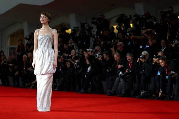 Cast member Emma Stone marks her presence at the screening of 