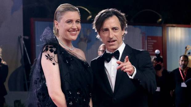 Director Noah Baumbach and cast member Greta Gerwig pose on the red carpet at the screening of 