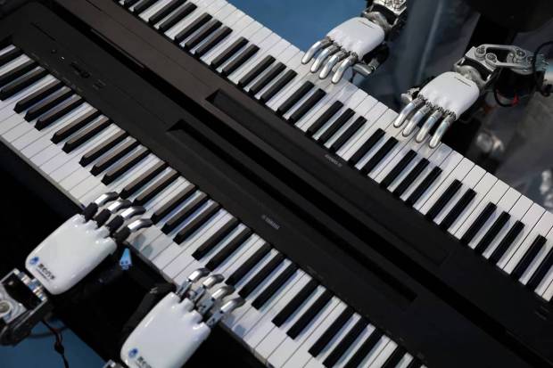 Robots surprised the audience by playing musical instruments. (Photo source: Reuters).