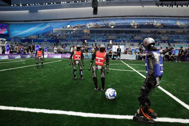 Humanoids also tried a five in a team soccer and often got tangled in heaps. (Photo source: Reuters).