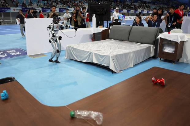 Robots were seen playing soccer, performing cleaning tasks, and performing medical sorting. (Photo source: Reuters).