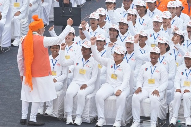 Prime Minister Narendra Modi gestures to children after addressing the nation from the rampart of the 17th century Mughal-era Red Fort monument during the country's Independence Day celebrations in New Delhi. (Image source: PTI)