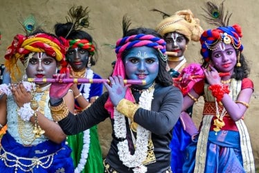 Young boys dressed up as Lord Krishna on the eve of the 'Janmashtami' festival, in Nadia. (Image source: PTI)