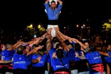 Spain's Castellers de Vilafranca team form a human pyramid to break a 'dahi handi' ahead of Janmashtami festival, in Mumbai. (Image source: PTI)