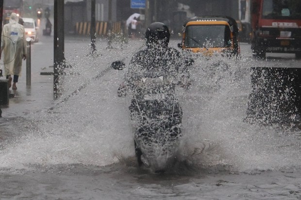 A red alert has been issued in ghat regions after fatalities were reported from Beed, Mumbai, and Nanded. According to the Maharashtra Disaster Management Department, six people have died across the state due to incessant rains and flood-linked incidents. Villages have been evacuated and several residents shifted to relief shelters for safety. (Express Photo)