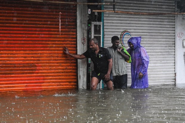 After 48 hours of non-stop torrential rainfall, Mumbai has been left crippled with waterlogged roads and transport disruption. The India Meteorological Department (IMD) has issued a red alert for extremely heavy rainfall in Mumbai on Wednesday, August 20. This comes just a day after yet another spell of downpour lashed the Maharashtra capital for the fifth straight day, crippling normal life with widespread flooding, halted train services, diverted flights and evacuation efforts in low-lying areas. In some parts of Mumbai school and colleges are closed, private companies were also urged to let employees work from home after the city recorded nearly 1000 mm of rainfall. (Express Photo)