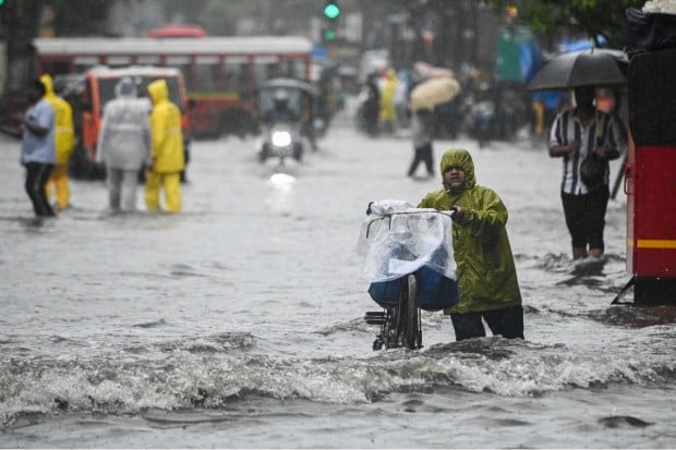 Mumbai’s lifeline, its suburban train network, faced severe disruption due to flooding on multiple routes. Services on the Central Railway’s main line between CSMT and Thane were restored by 7:30 pm on Tuesday, but the harbour line remained suspended well past midnight due to floodwaters submerging tracks. (Express Photo)