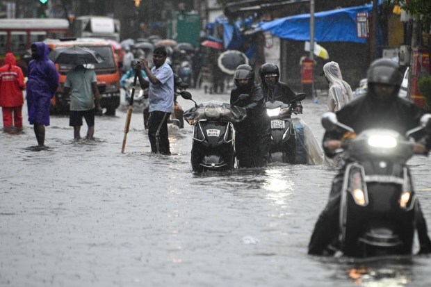 Daily life has come to a grinding halt, with residents struggling to commute and civic authorities overwhelmed by the extent of flooding across the city. (Express Photo)