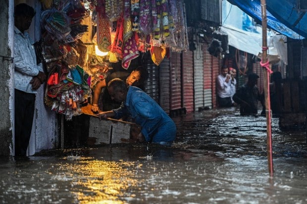 Although the BMC has not officially declared a school holiday in Mumbai, nearby regions like Lonavala have shut schools due to heavy rain warnings. Mumbai University has also rescheduled its examinations originally set for August 19 to August 23 to ensure the safety of students. With persistent rainfall, residents have been advised to step out only when absolutely necessary. (Express Photo)