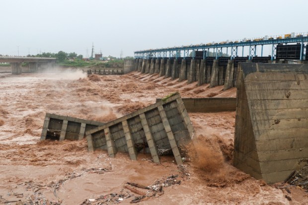 Portion of Madhopur Headworks barrage washes away amid rise in the Tawi river water level due to heavy rainfall. (Image source: PTI)