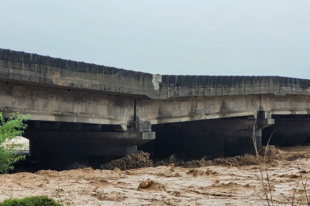 A pillar of a bridge on the Jammu-Pathankot National Highway damaged due to swollen river during the monsoon season. (Image source: PTI)