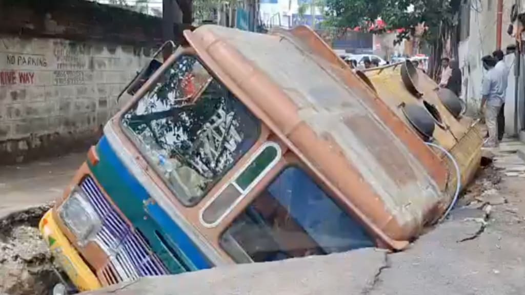 A video of the water tanker lodged inside the road Banjara Hills has gone viral on social media. The driver and the cleaner of the tanker, per the reports, have suffered injuries. A video of the water tanker lodged inside the road Banjara Hills has gone viral on social media. The driver and the cleaner of the tanker, per the reports, have suffered injuries.