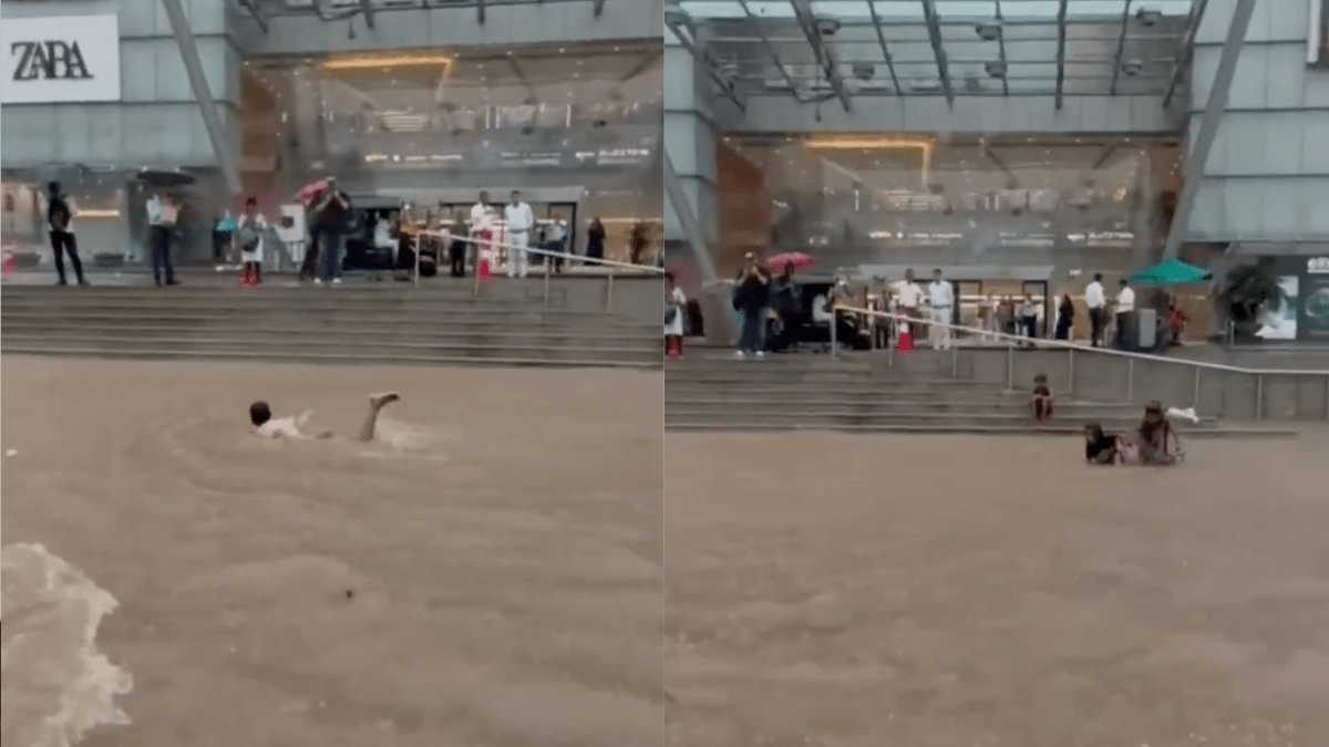 The now-viral video shows a boy swimming outside Goregaon Mall after heavy rains inundated Mumbai streets. The now-viral video shows a boy swimming outside Goregaon Mall after heavy rains inundated Mumbai streets.