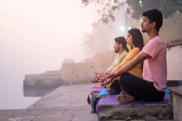Move your body: Doing exercise regularly, like cycling, walking, or yoga, may help in releasing tension and in boosting mood. (Photo source: Canva)