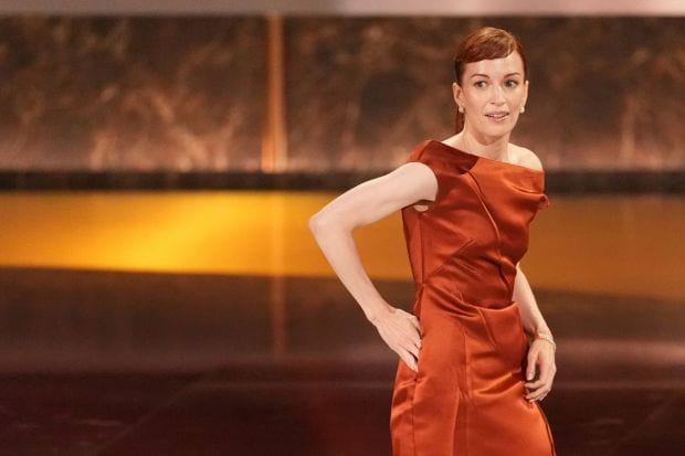 Honorary mention for Britt Lower's Calvin Klein gown with a pocket as the 'Severence' star beat time with convenience. This Emmy awardee was seen in the copper-silk gown. (Image: AP)