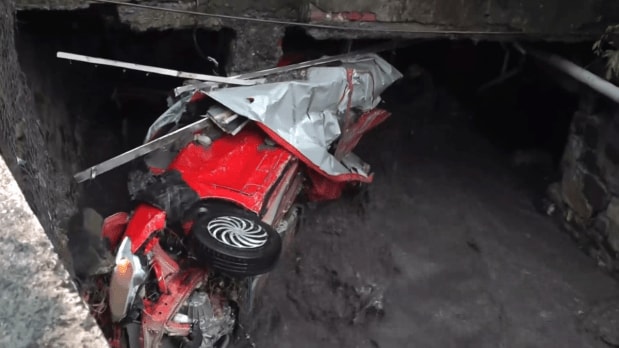 Multiple vehicles were caught in the wave of destruction in Uttarakhand. As SDRF officials conduct rescue operations, no official statistics regarding the deaths caused by the disaster have been released yet. (In Frame: a vehicle lies amid mud and water after heavy rains triggered a cloudburst in Dehradun.) (Photo Source: PTI)