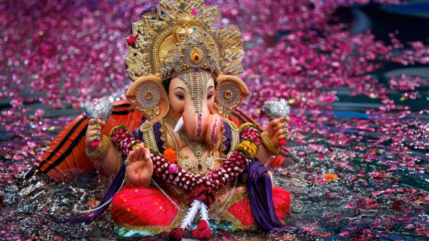  An idol of Lord Ganesha being immersed into an artificial pond during the Ganesh Chaturthi festival celebrations, in Mumbai.