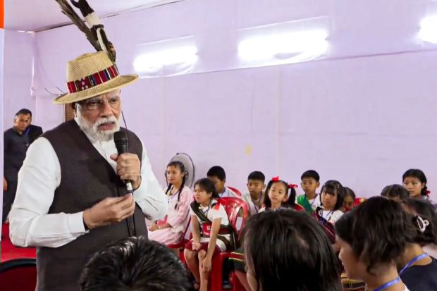 PM Modi also met with people is distress, those living in relief camps, 2 years after the Manipur violence. He was welcomed there with a bouquet, a hand-drawn portrait, and a traditional Manipuri hat called Kokyet. (Image: PTI)