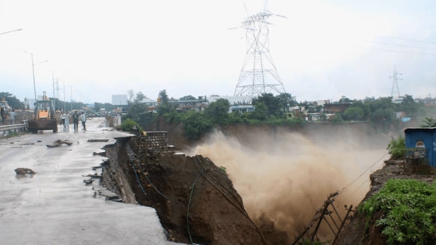The floods caused widespread damage to key roadways connecting the city. (In Frame: A bridge gets washed away following heavy rains, near Uttarakhand Dental College on the Dehradun - Haridwar National Highway) (Photo Source: PTI)