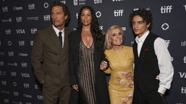 Matthew McConaughey (from left), Camila Alves, Kay McConaughey, and Levi McConaughey arrive arm-in-arm for the “The Lost Bus” premiere, capturing a family affair under festival lights.
