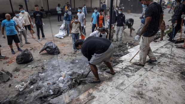 Following the protest, Gen Z  demonstrators organise a clean-up drive to sweep away debris from a road following the violent protest against the Government over alleged corruption, in Jhapa on Wednesday. (Photo Source: Associated Press)
