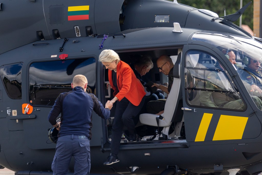 President of the European Commission Ursula von der Leyen gets out of the helicopter after inspecting the Lithuanian-Belarusian border on September 1 | AP Photo