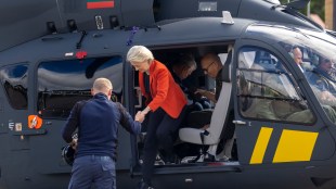 President of the European Commission Ursula von der Leyen gets out of the helicopter after inspecting the Lithuanian-Belarusian border on September 1 | AP Photo