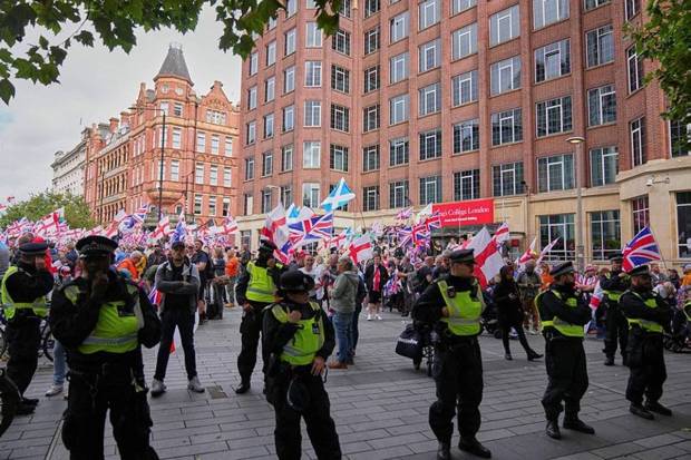 Protest signs carried slogans such as “Stop the boats” and “Save our children.” (Photo source: AP)