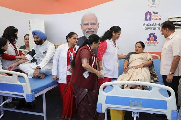 Delhi CM Rekha Gupta donated the first unit of blood at a camp on Kartavya Path, calling it a tribute to PM Modi’s message of service. (Photo source: PTI)