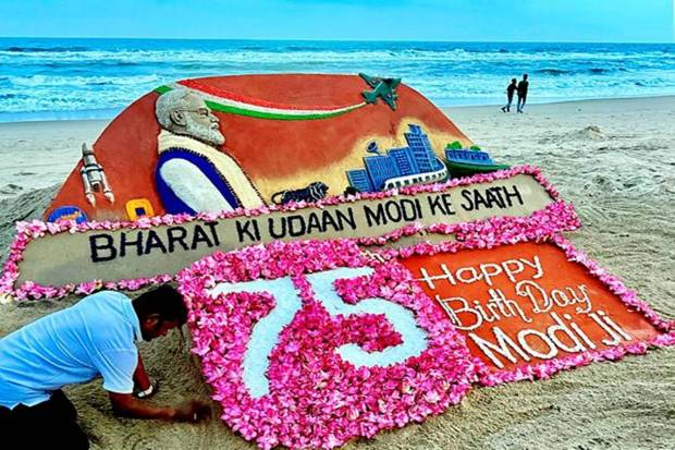 Puri beach was turned into a canvas as Sudarshan Pattnaik made a special sand art for PM Modi’s 75th birthday. (Photo source: PTI)