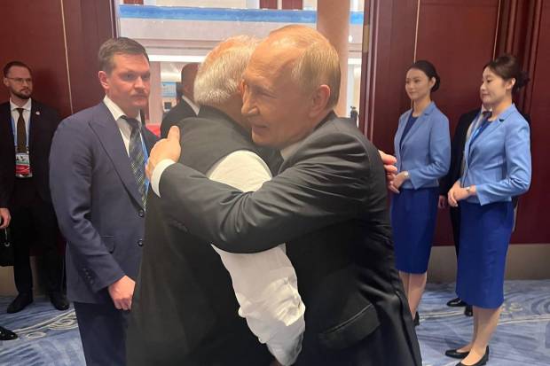 PM Modi and Russian President Putin greeted each other with a warm hug. (Photo source: ANI)