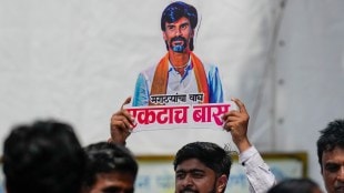 An agitator holds a cutout of activist Manoj Jarange Patil during his indefinite hunger strike demanding reservation for the Maratha community (Photo: PTI)