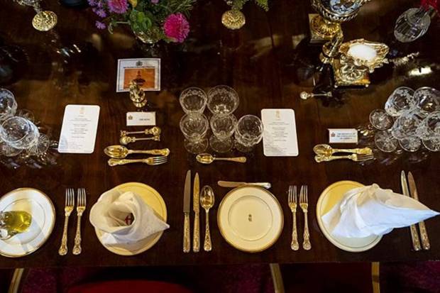 Place settings for King Charles and U.S. President Donald Trump are seen on the banquet table in St George's Hall, Windsor Castle, in Windsor, England. (Photo source: AP)