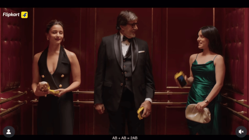 Before the surprise settles, Amitabh Bachchan steps in, also holding a phone with the identical cover. Before the surprise settles, Amitabh Bachchan steps in, also holding a phone with the identical cover.