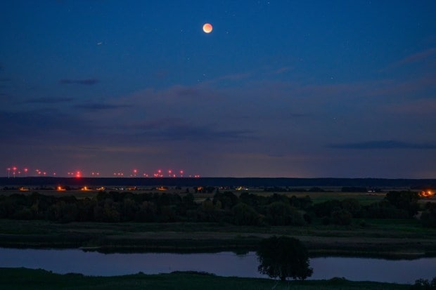 People watched with the naked eye, while others brought out binoculars and telescopes for a closer look. This was the longest total lunar eclipse visible in India since 2022 and the first one since July 27, 2018, that could be seen nationwide. (Image: AP)