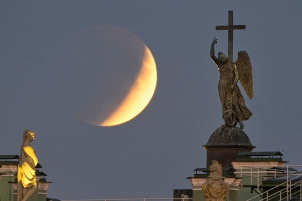 Shorter blue wavelengths scatter away, while the longer red ones pass through and reflect onto the Moon. It’s the same atmospheric trick that paints our skies orange and red at sunset. (Image:AP)