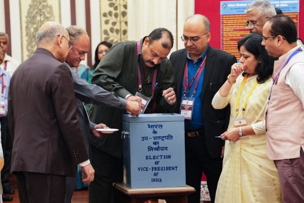 Rajya Sabha Secretary General PC Mody looks on as a ballot box is prepared before voting begins for the vice presidential election, at the Parliament premises. (Image: PTI)