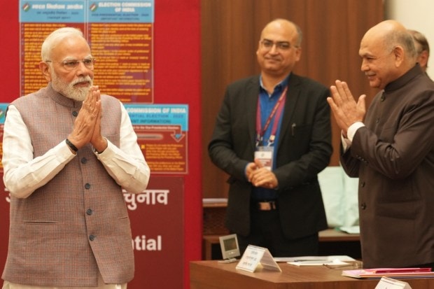 Prime Minister Narendra Modi with Rajya Sabha Secretary General PC Mody during the vice presidential elections, at the Parliament premises. (Image: PTI)