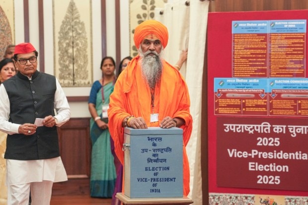 BJP MP Umesh Nath Maharaj casts his vote in the vice presidential elections, at the Parliament premises. (Image: PTI)