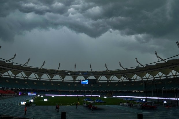 The Jawaharlal Nehru Stadium stands drenched in rain during the World Para Athletics Championships, with the weather creating challenging conditions for the ongoing sporting event. (Image: PTI)