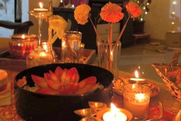 A little snap of Ananya's beautiful table arrangement. She's set the table with a floating lotus flower at the center, surrounded by diyas, candles and more flowers. She uses an easy thumb rule while decorating: When in doubt, add more light and flowers. (Image source: Pinterest)