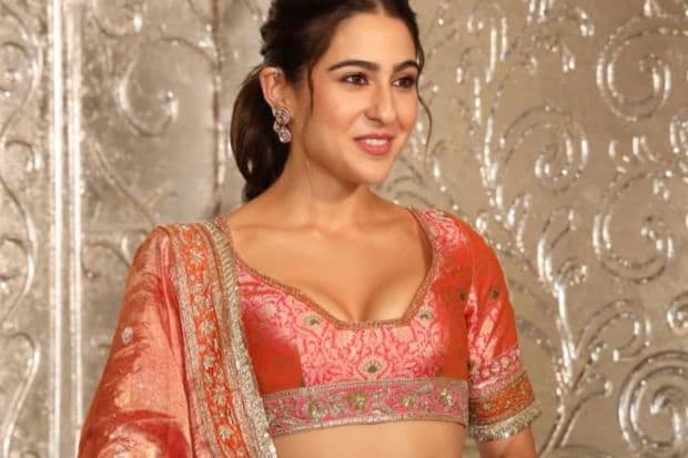 Sara Ali Khan, last seen in Metro...In Dino, flaunted her soft glow with a coral pink and orange lehenga on the red carpet affair. Also seen opposite Veer Pahariya in Sky Force, she kept it minimal and went with a pony tail. (Image: X)