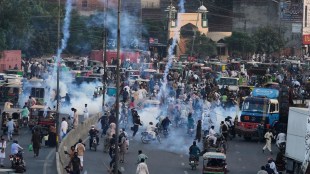 Police fire tear gas shells to disperse supporters of Islamist party 'Tehreek-e-Labbaik Pakistan' during their pro-Palestinian march toward the capital Islamabad, in Lahore, Pakistan, Friday, Oct. 10, 2025. AP/PTI(AP10_10_2025_000312A)