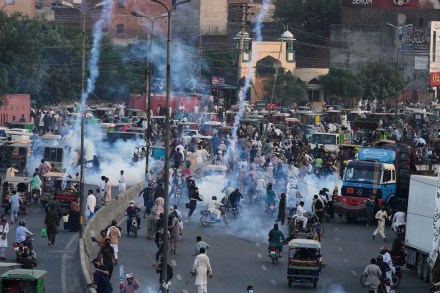 Police fire tear gas shells to disperse supporters of Islamist party 'Tehreek-e-Labbaik Pakistan' during their pro-Palestinian march toward the capital Islamabad, in Lahore, Pakistan, Friday, Oct. 10, 2025. AP/PTI(AP10_10_2025_000312A)