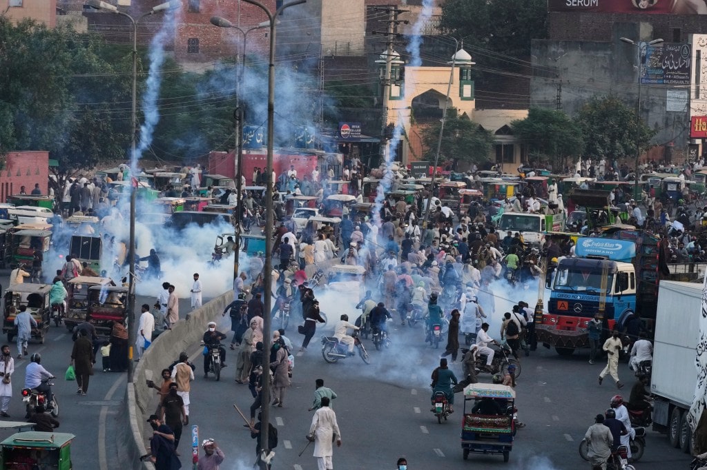 Police fire tear gas shells to disperse supporters of Islamist party 'Tehreek-e-Labbaik Pakistan' during their pro-Palestinian march toward the capital Islamabad, in Lahore, Pakistan, Friday, Oct. 10, 2025. AP/PTI(AP10_10_2025_000312A)
