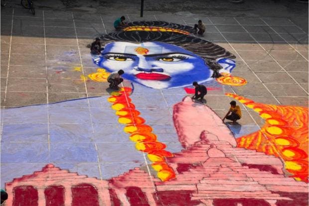 Students make a 'rangoli' of Lord Ram for the 'Diwali' celebrations in Moradabad. (PTI)
