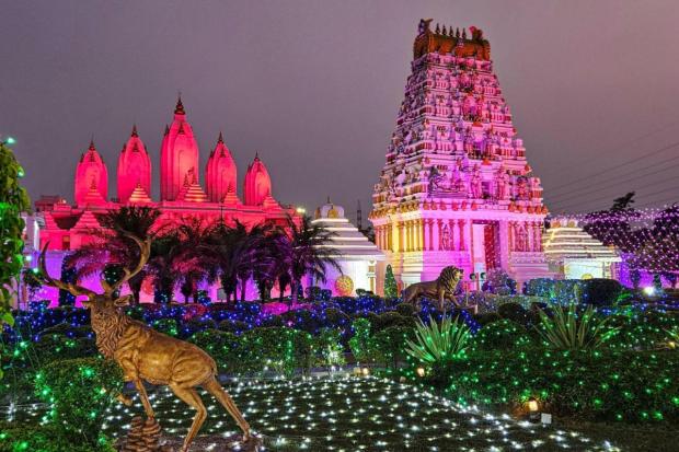 Premises of Shri Sidhdata Ashram are illuminated with light during the ‘Diwali’ festivities in Faridabad. (PTI)