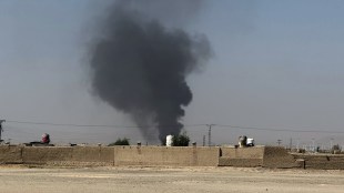 Smoke goes up after a shell exploded in a border area during clashes between Pakistan and Afghan forces, as seen from Pakistan side of the border near Chaman, Pakistan, Wednesday, Oct. 15, 2025. (AP Photo/H. Achakzai)